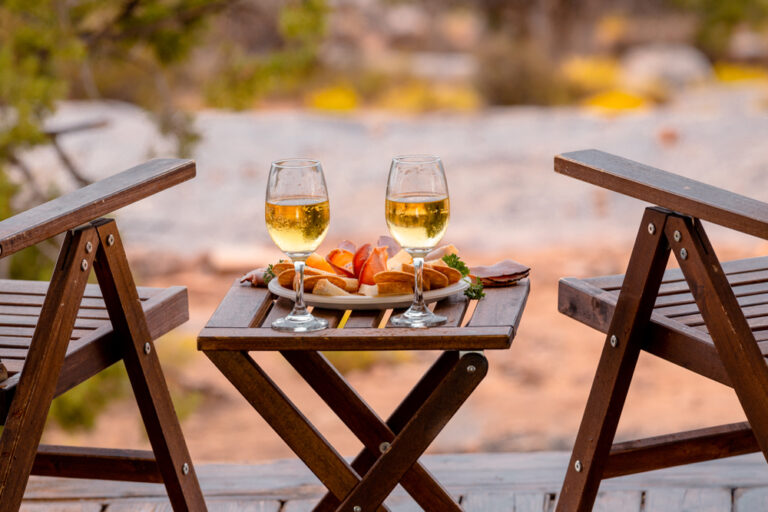 wineglasses and deck chairs for glamping