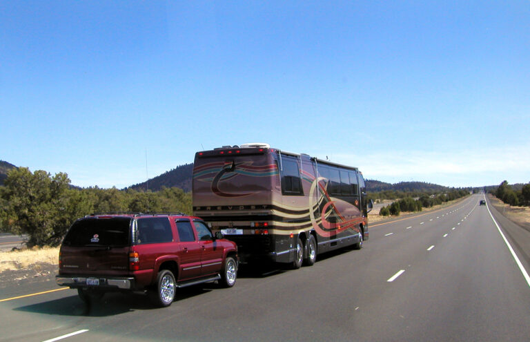 an RV towing a car - Shutterstock photo