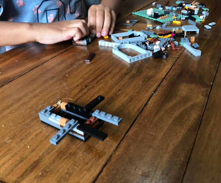 kid playing with LEGO