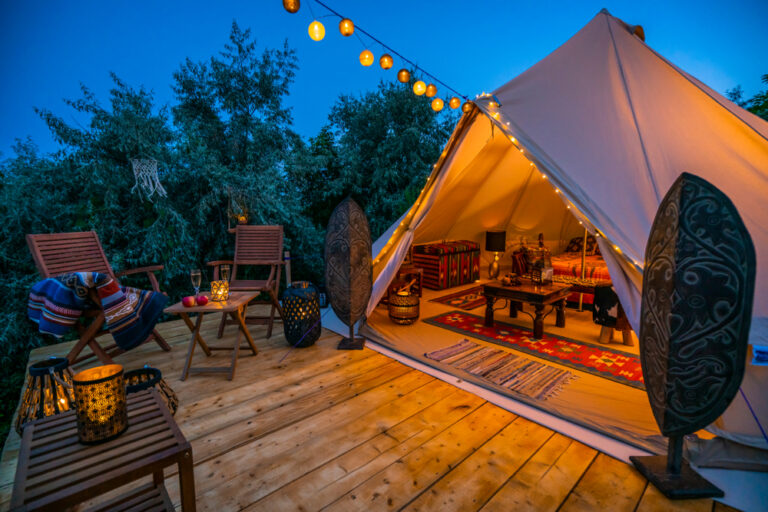 a glamping tent strung with fairy lights