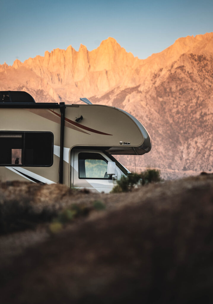 A Class C RV at sunset