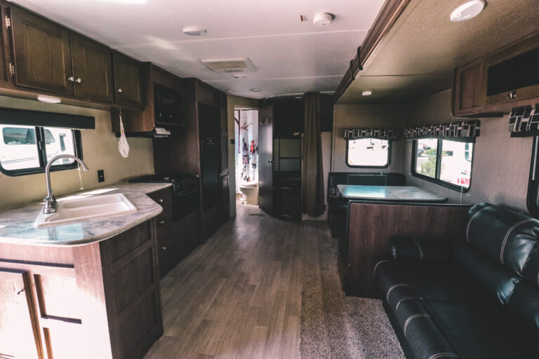 An RV kitchen and dining area