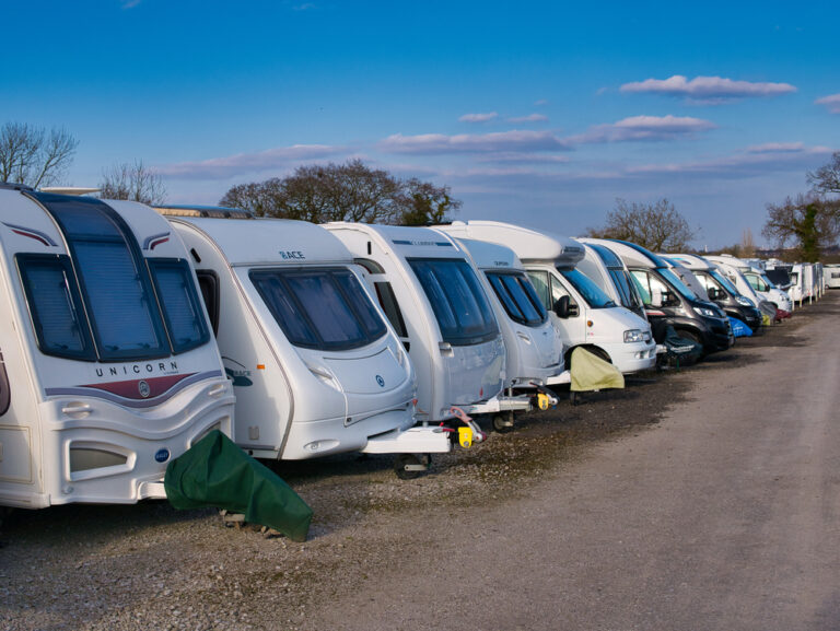 RVs lined up in a storage area