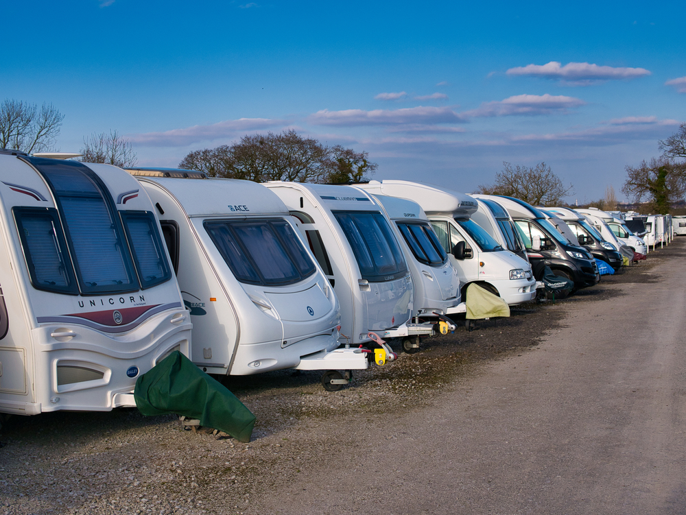 RVs lined up in outdoor storage