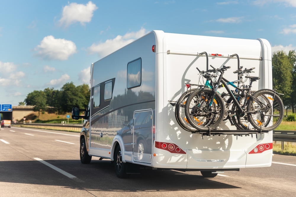 an RV with bikes attached to the back