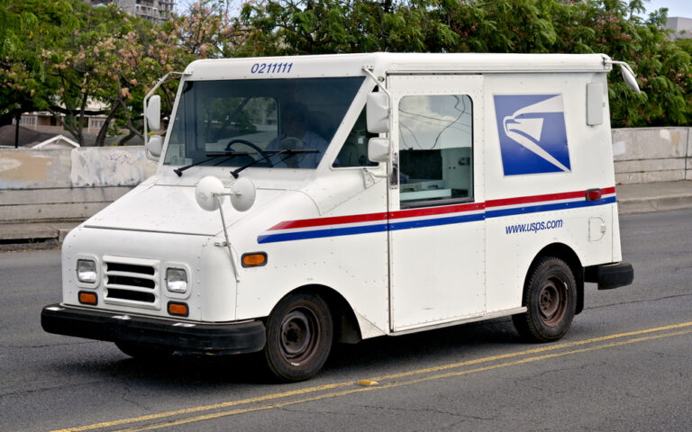 a USPS truck on the road