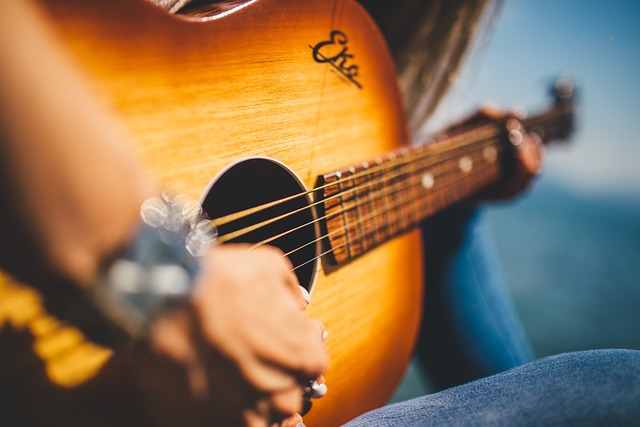 a woman playing guitar