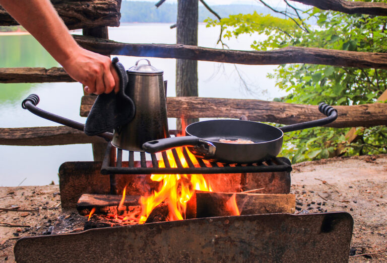 a campfire breakfast with coffee and eggs