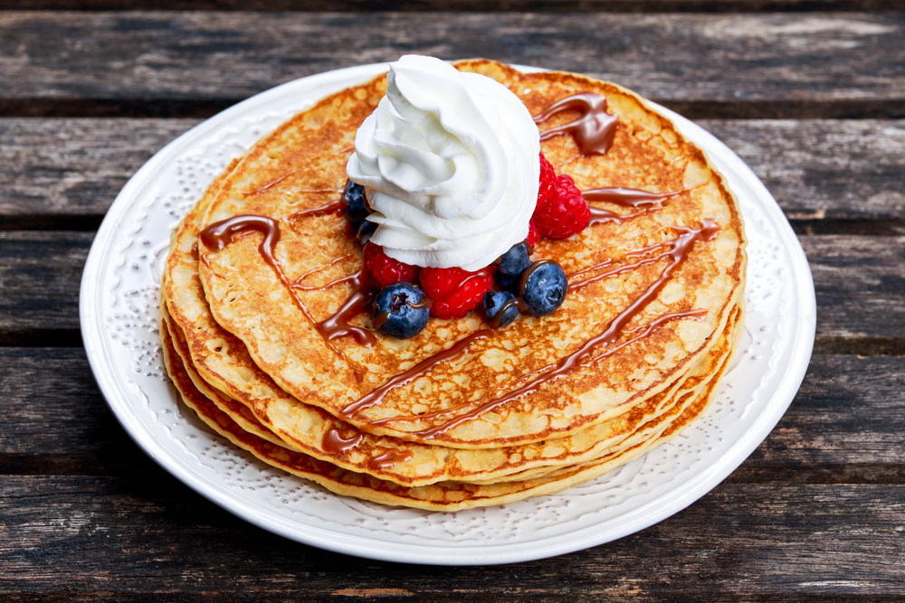Berry pancakes with whipped cream