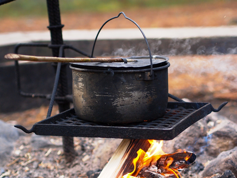 a Dutch oven over a campfire