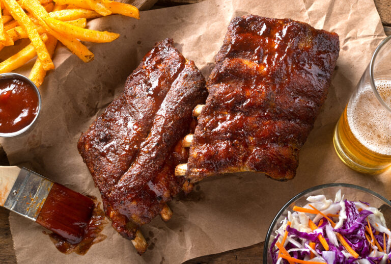 Barbequed baby back ribs with sauce