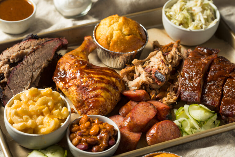 Barbeque platter with chicken, mac and cheese, and a biscuit