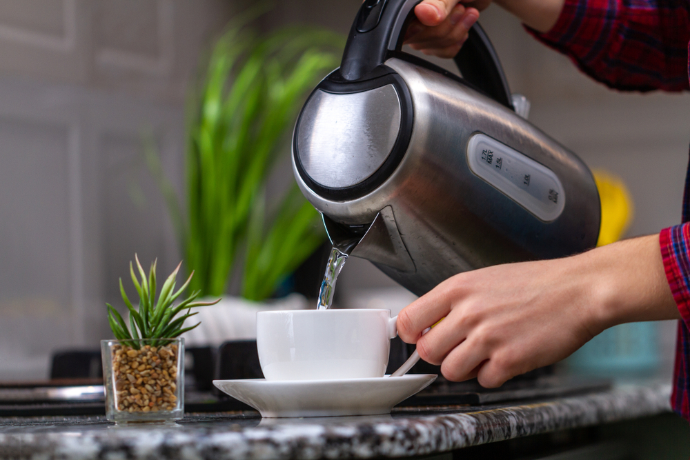 An electric kettle pouring water