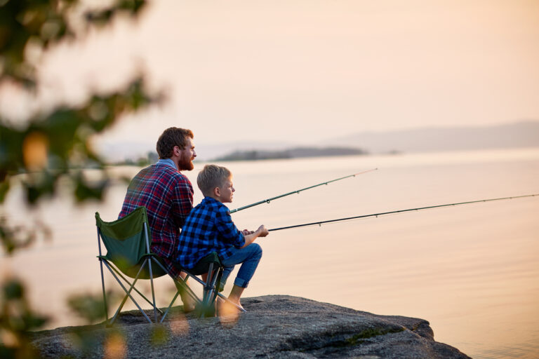 A dad fishing with his son