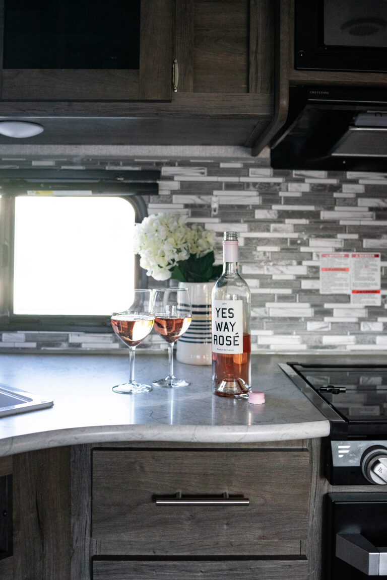 an RV kitchen with upgraded tile backsplash