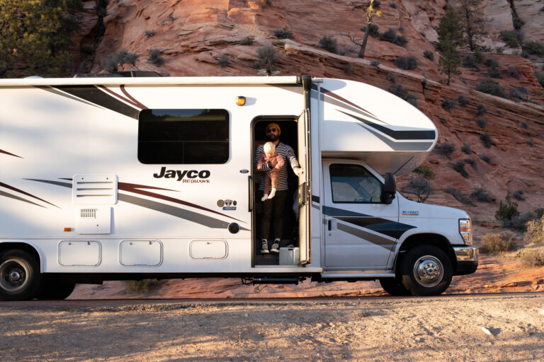 A man dressed for slightly chilly weather standing in an RV