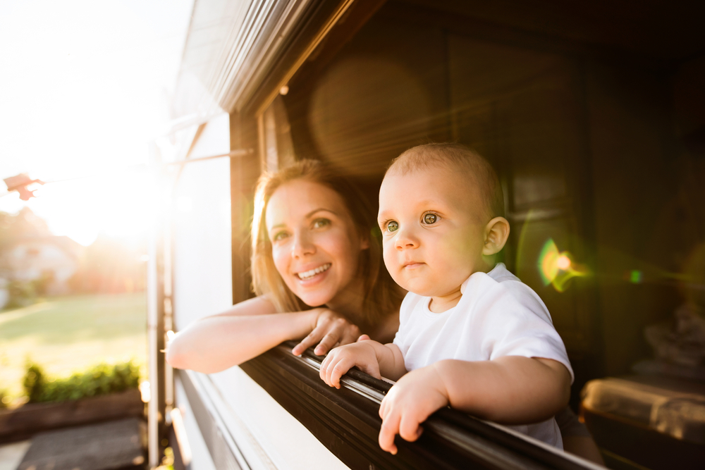 Mother and baby son in a camper van.