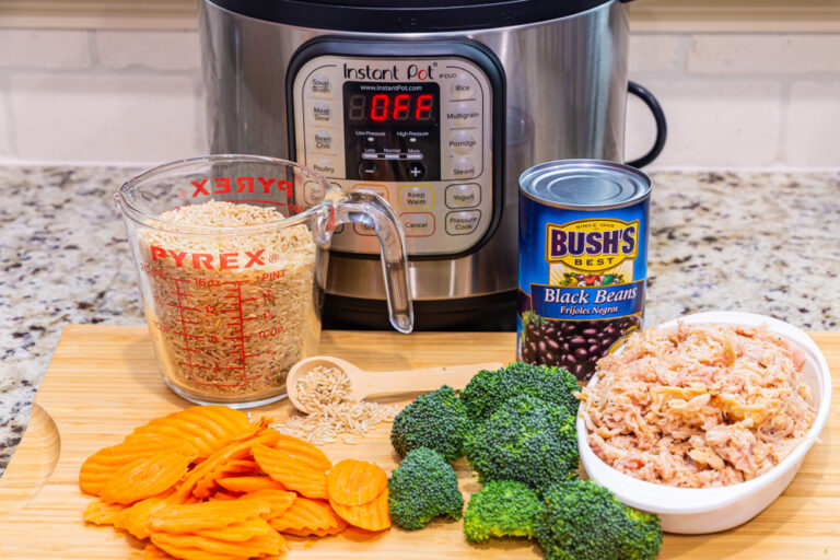 An Instant Pot with food ingredients in front of it