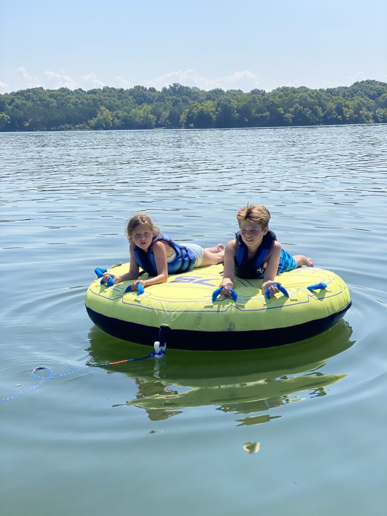 Kids on a water inner tube