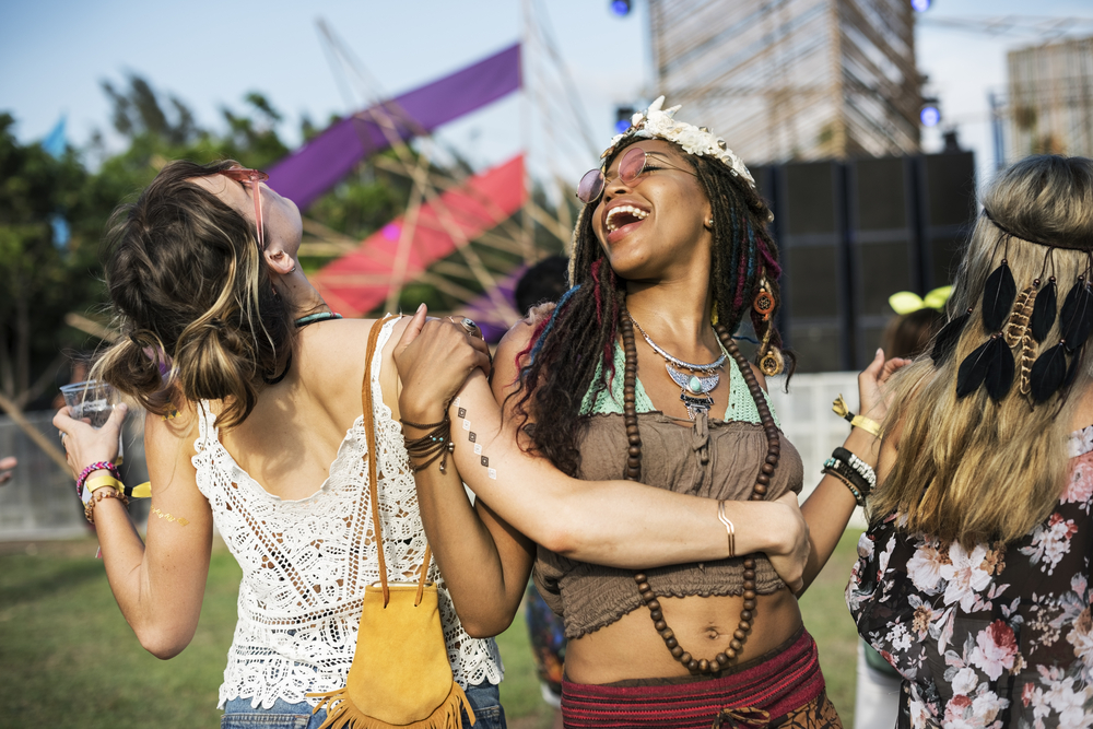 women dancing at music festival