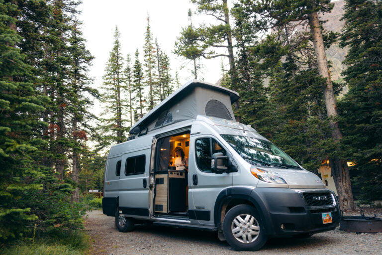 a campervan set up in a forest