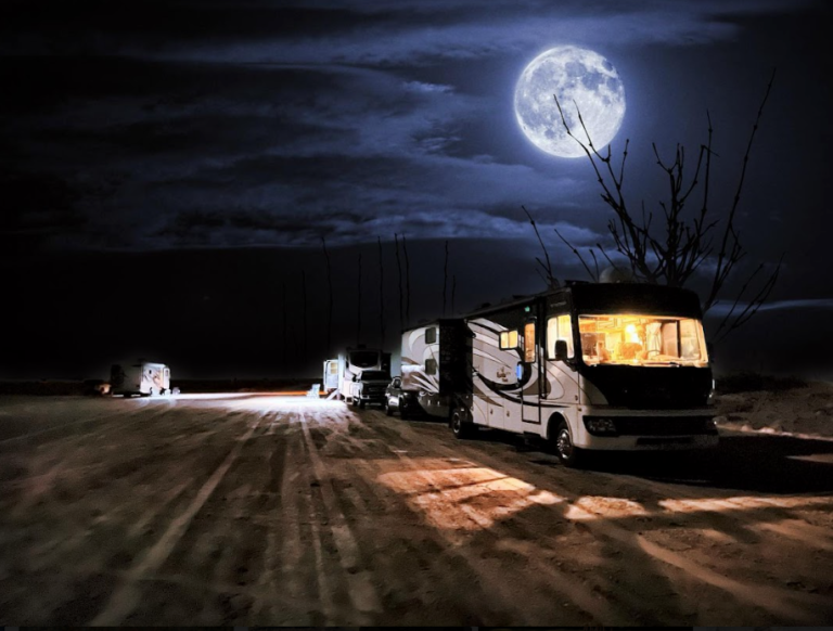 an RV lit up at night