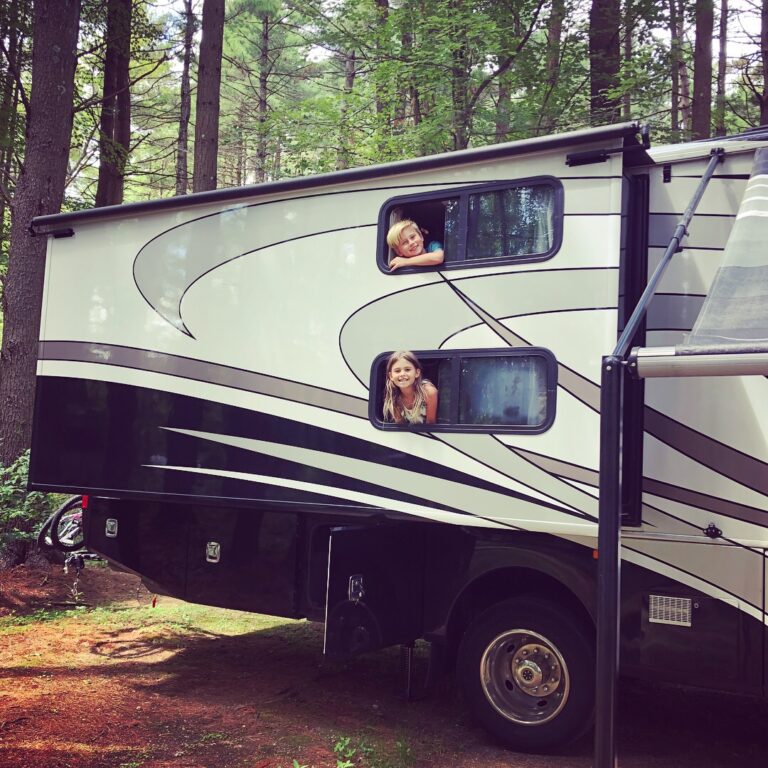kids looking out an RV window