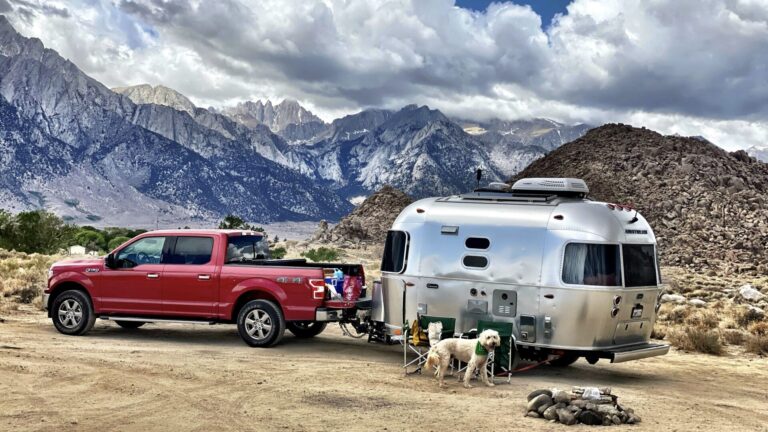 RV towing: truck towing a trailer to a boondocking spot