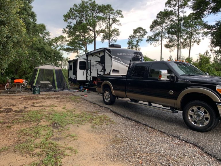 5th wheel trailer and truck backed into a campsite