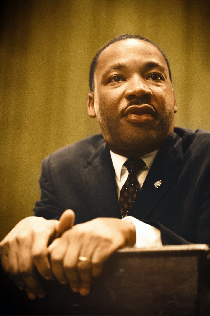 Martin Luther King Jr at podium, color photo