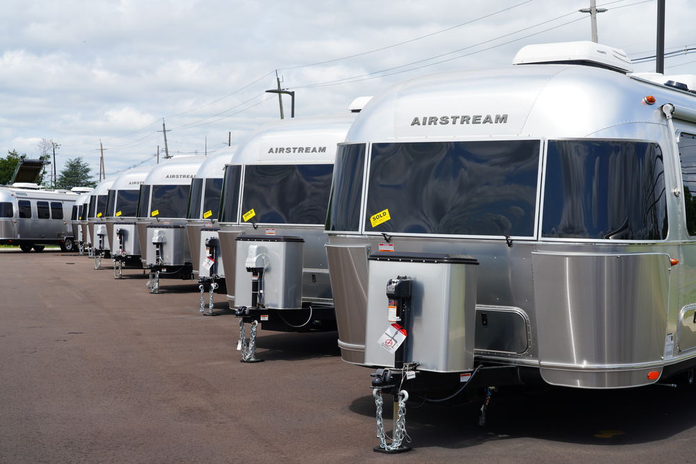 View of aluminum Airstream RV trailers sold on the lot of the Colonial motorhomes dealership in Millstone Township, New Jersey, USA.