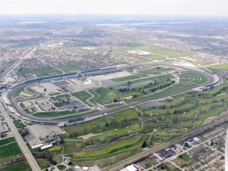 Aerial view of Indianapolis 500, an automobile race held annually at Indianapolis Motor Speedway in Speedway, Indiana through clouds. View from airplane. J