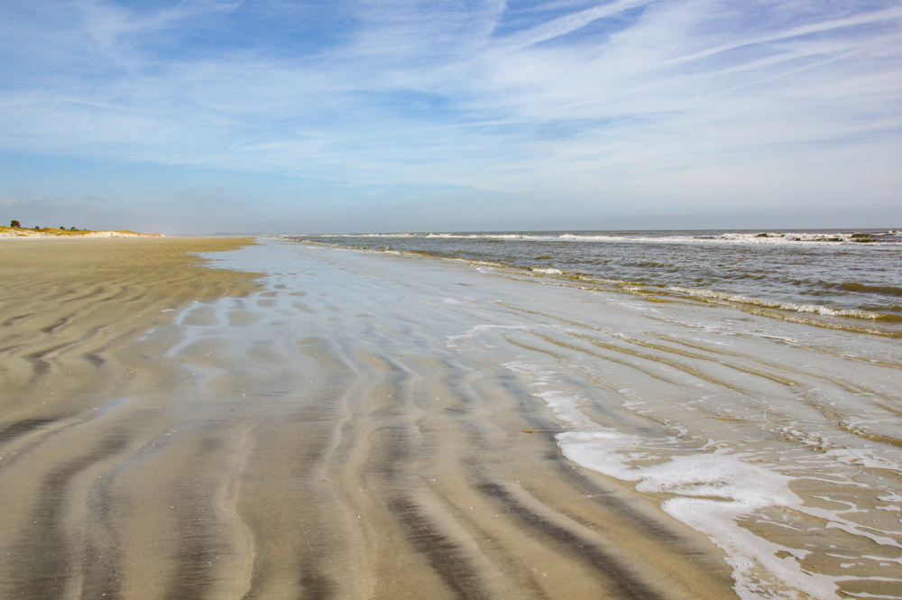 A beach without any people. The gentle waves roll in on the rippled sand on Sapelo Island, GA