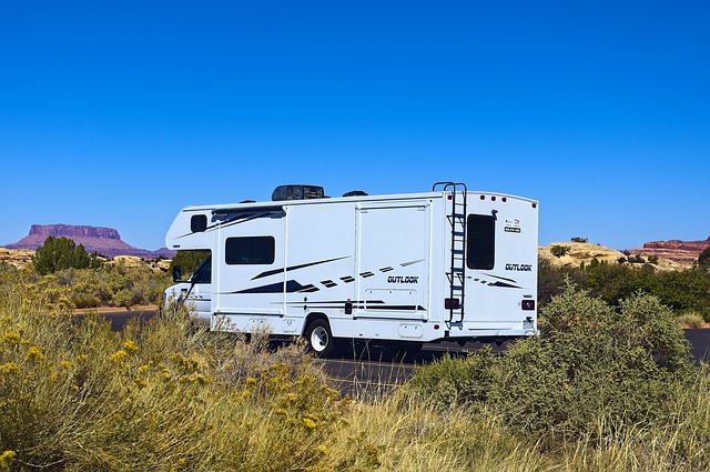 a Class C camper parked near desert in Needles, CA