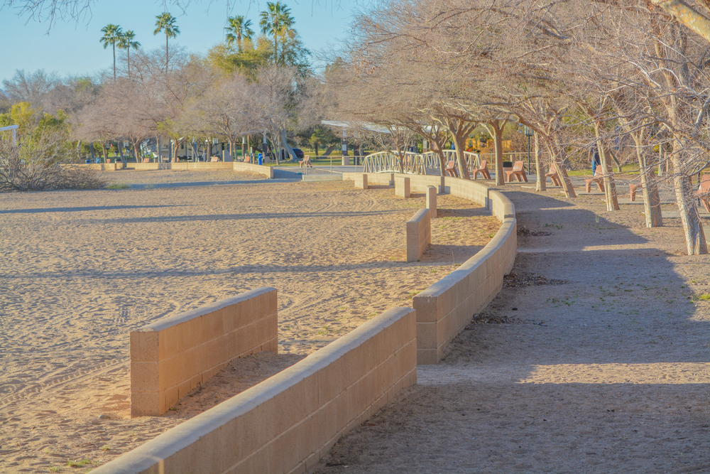 A walkway and beach along the Colorado River at the Rotary Community Park in Lake Havasu City, Arizona USA