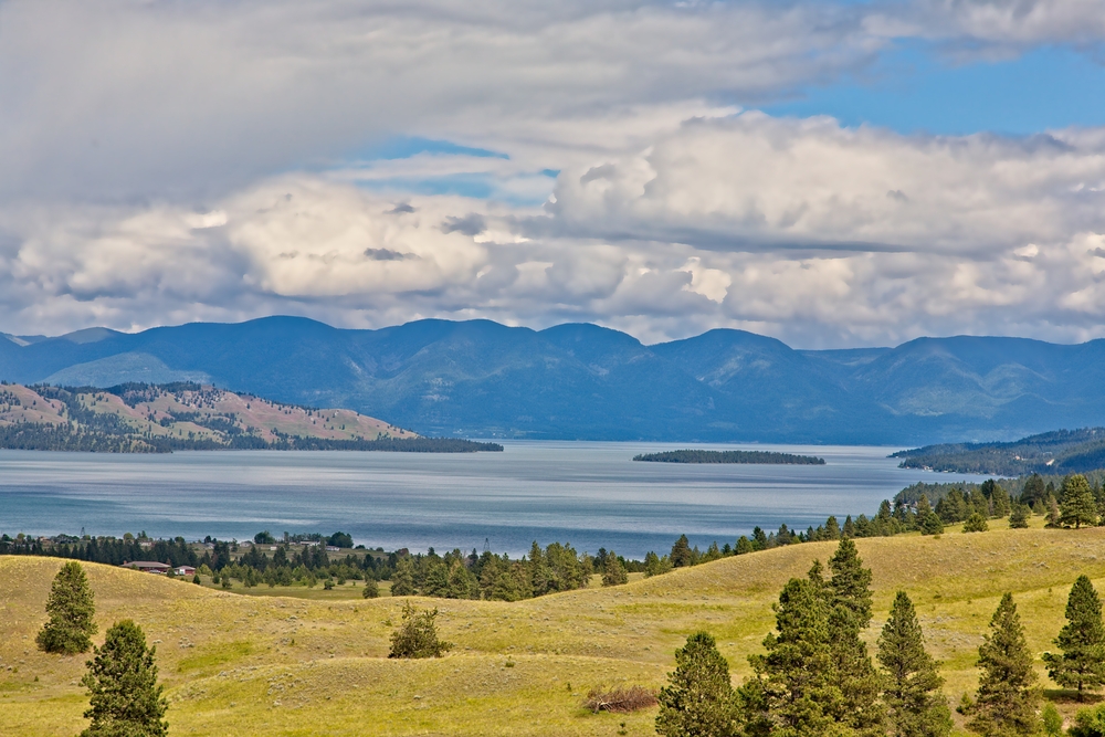 A scenic view of Flathead Lake from Polson,MT.with clouds over the mountains in the background