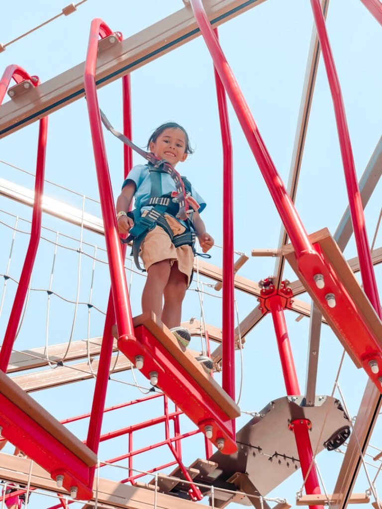 Child smiles while on obstacle course