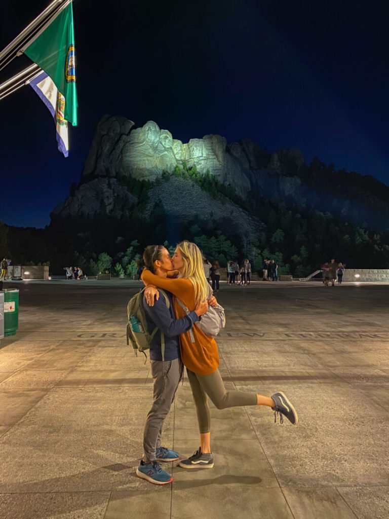 Couple kisses at Mount Rushmore