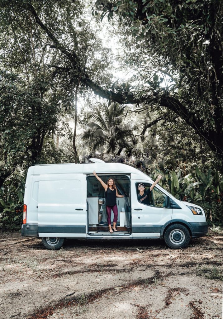 Couple poses with their campervan