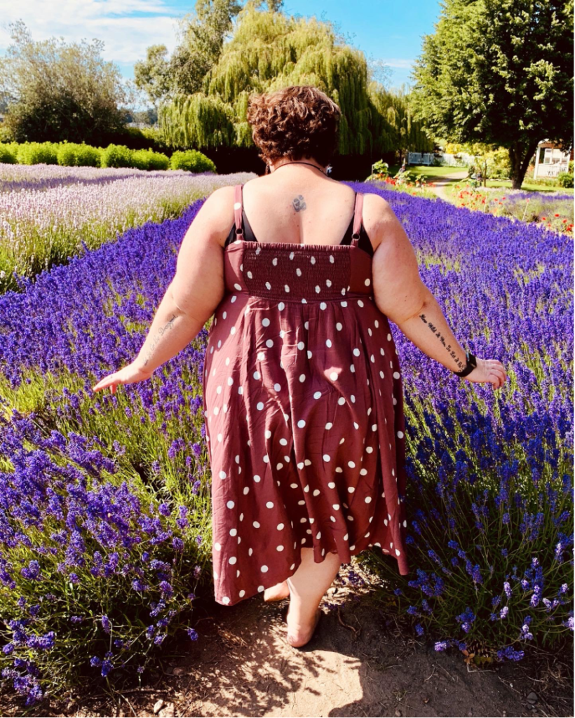 woman walks into lavender fields