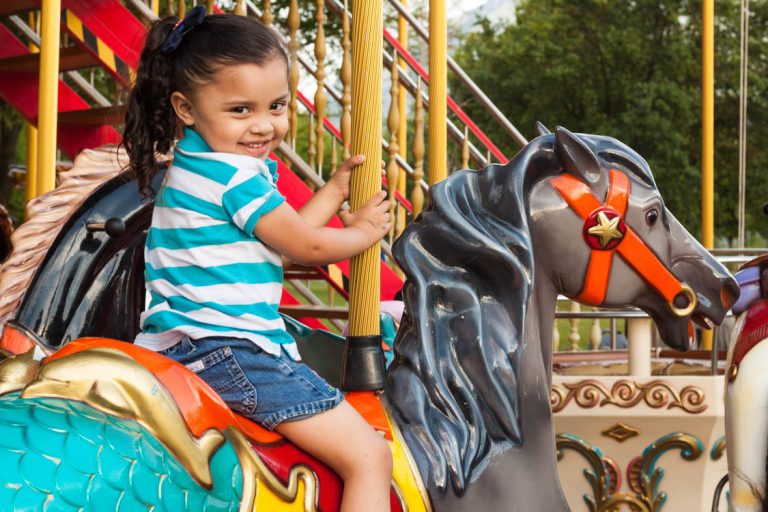 little girl on carousel