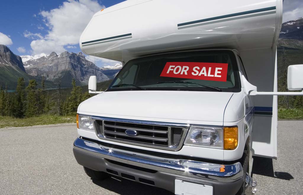 RV with a sale sign in the window