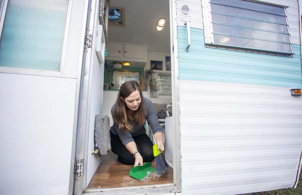 woman cleaning an RV