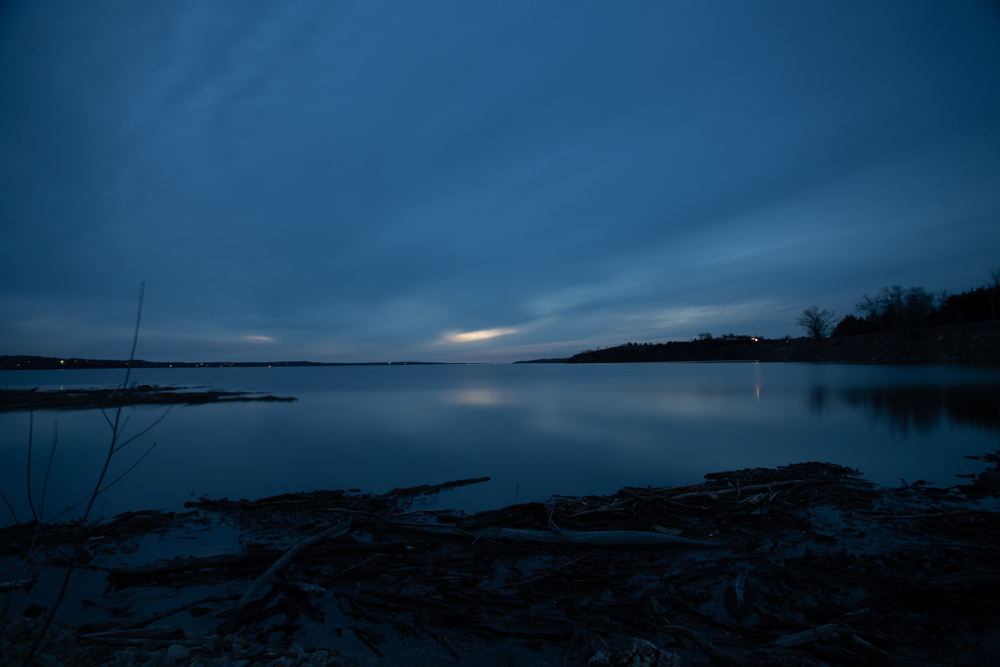 Cloudy sunset over a lake at tuttle creek Kansas.
