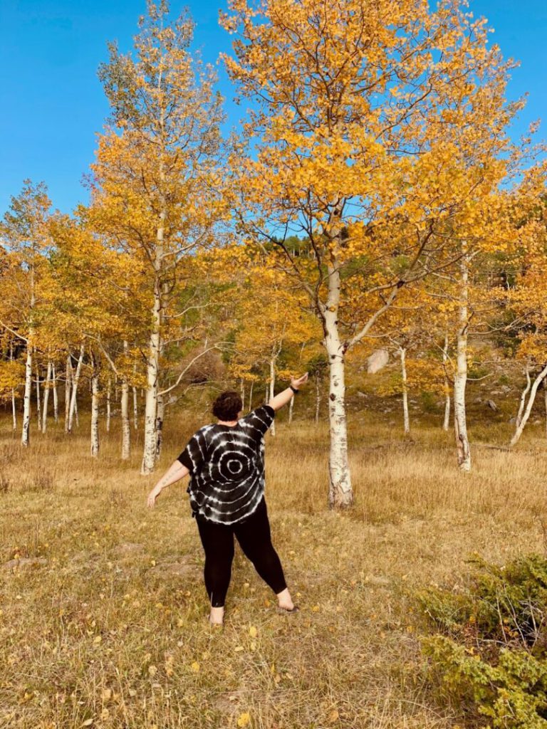 Woman enjoys a hike in Colorado during the fall