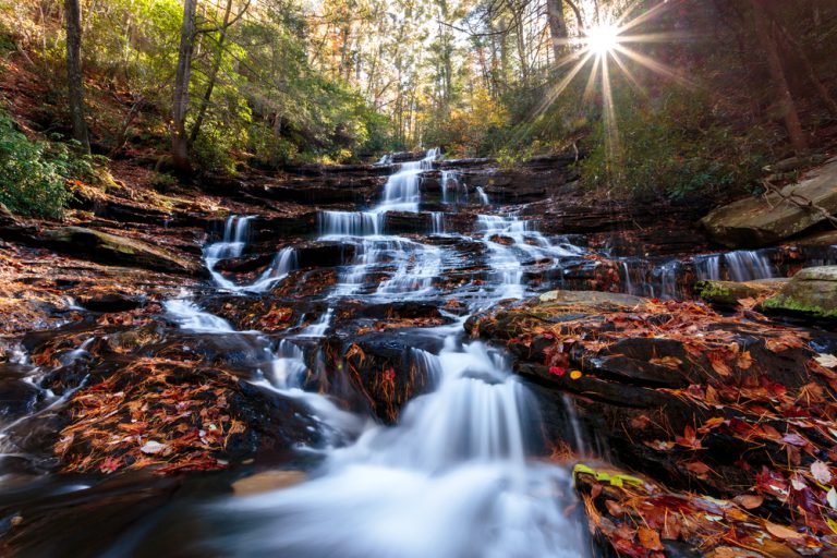 Waterfall with sunset in the background, fall colors, north Georgia USA