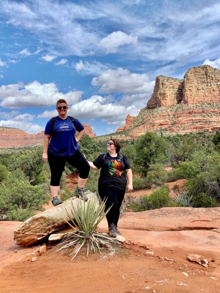 Couple poses on hike in desert of Arizona