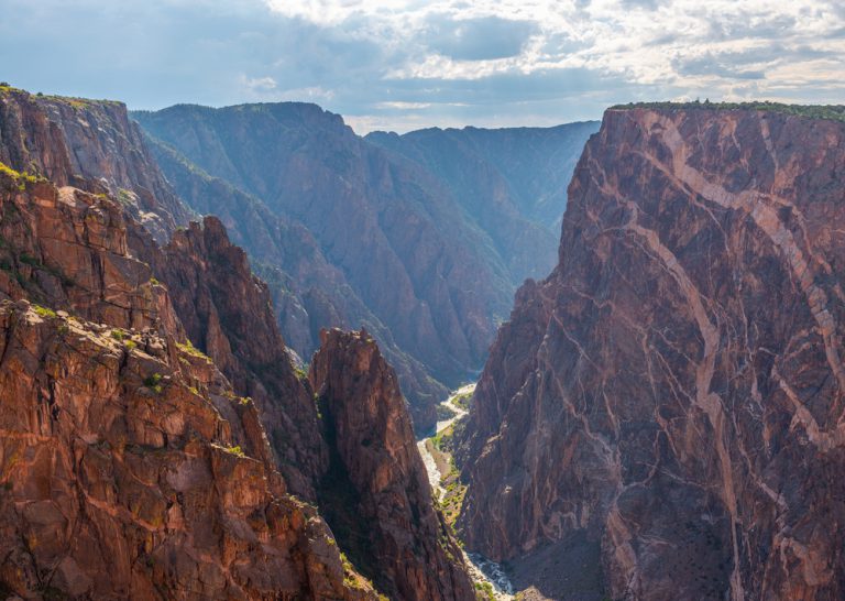 Black Canyon of the Gunnison with two dragons and the Gunnison River cutting through the rock in valley, Colorado, Black Canyon of the Gunnison national park, USA.