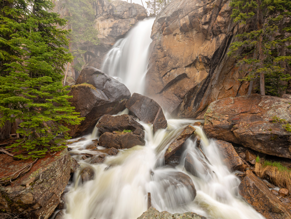 Mist and spray come off Ouzel Falls during high Spring runoff in the Wild Basin area of Rocky Mountain National Park, Allenspark, Colorado.