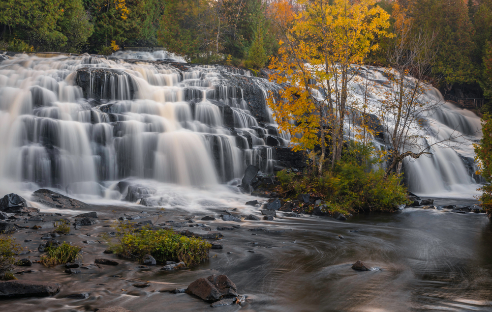 Scenic Bond falls in Michigan upper Peninsula under evening sun light